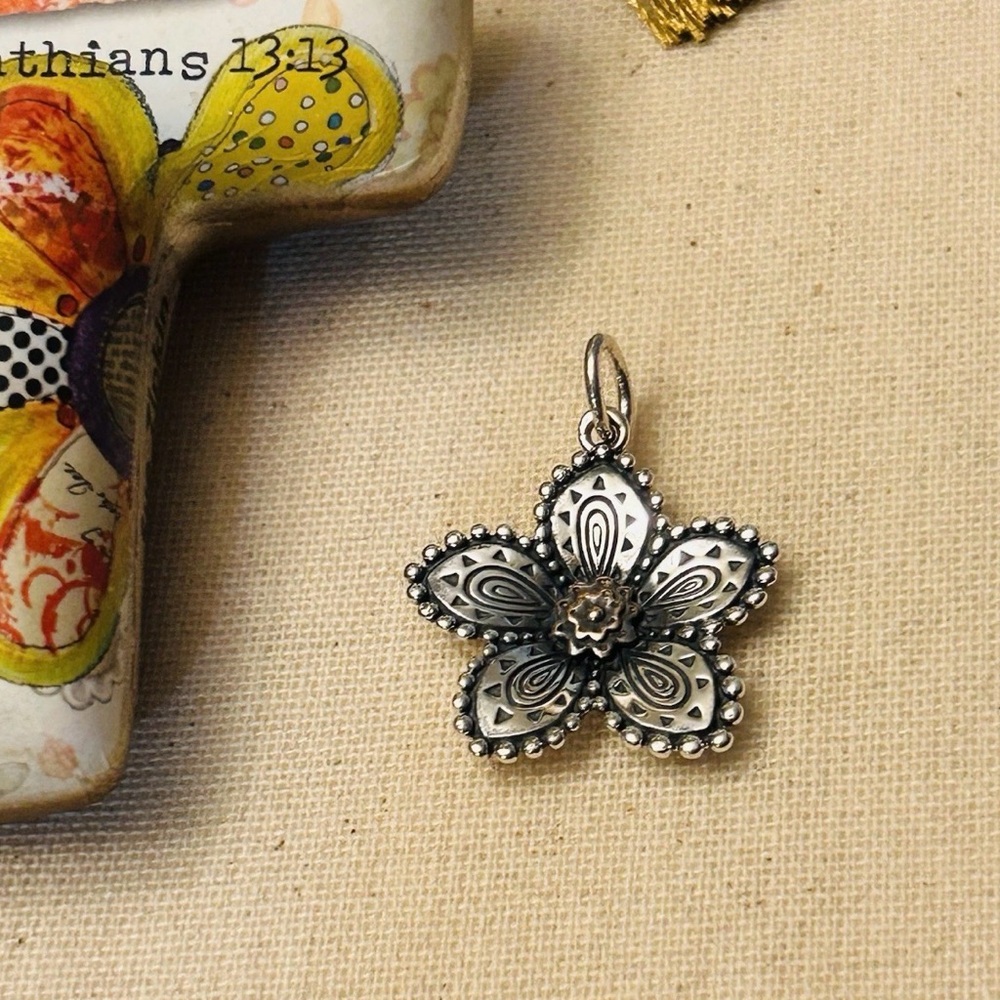 Retired James Avery festive flower pendant